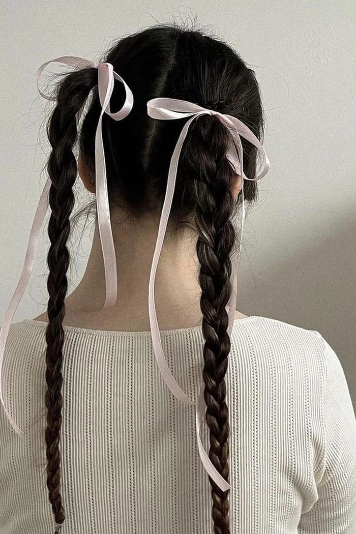 A quick coquette ponytail with a silk ribbon bow for a casual feminine look