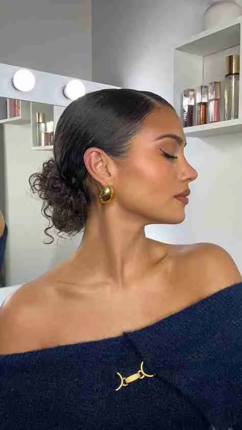 Easy slicked back bun for curly hair casual look