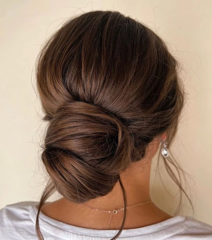 Effortless low chignon hairstyle perfect for casual evening dinners