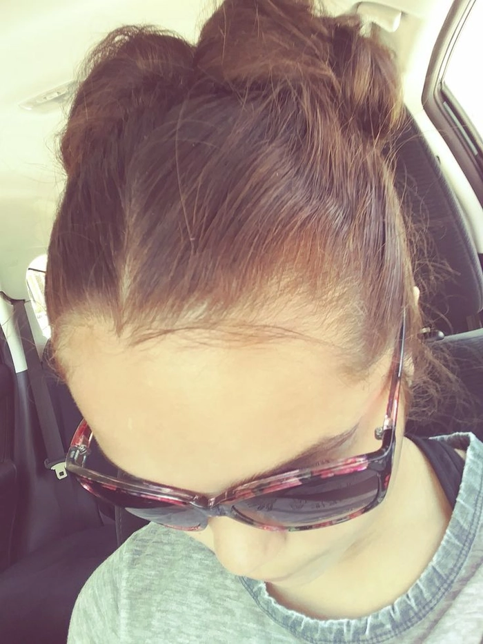 Effortless messy space buns hairstyle perfect for grunge casual aesthetics in a relaxed setting