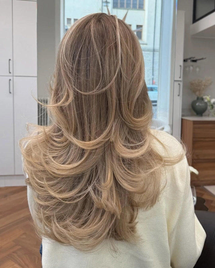 Everyday layered hair styling showcasing natural volume and effortless casual look