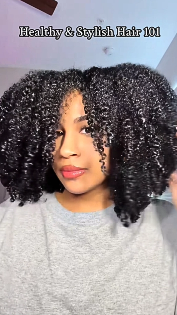 Short everyday layered hairstyle enhancing natural volume with soft waves