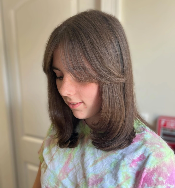 Everyday lob hairstyle featuring soft curtain bangs for a casual, effortless look