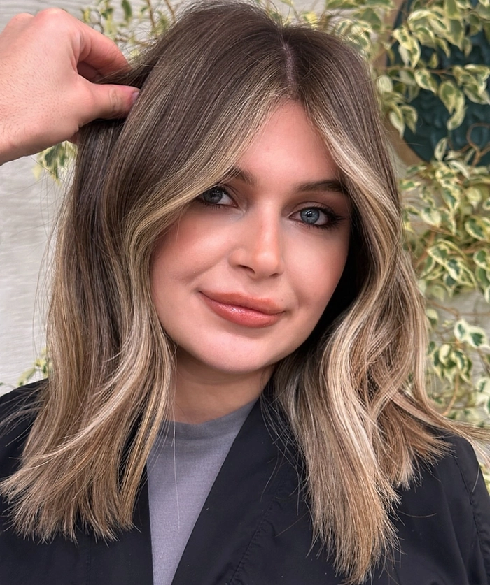 Everyday lob hairstyle featuring soft curtain bangs for a casual look