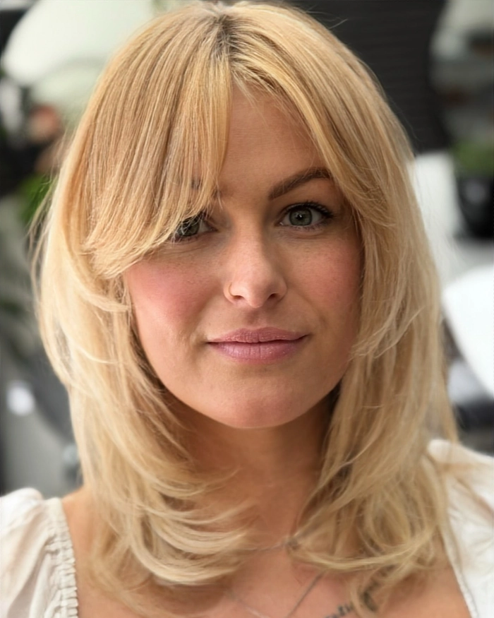 Everyday lob hairstyle with soft curtain bangs showcasing a casual look