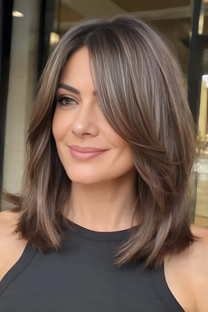 Everyday lob hairstyle featuring soft curtain bangs in a casual look