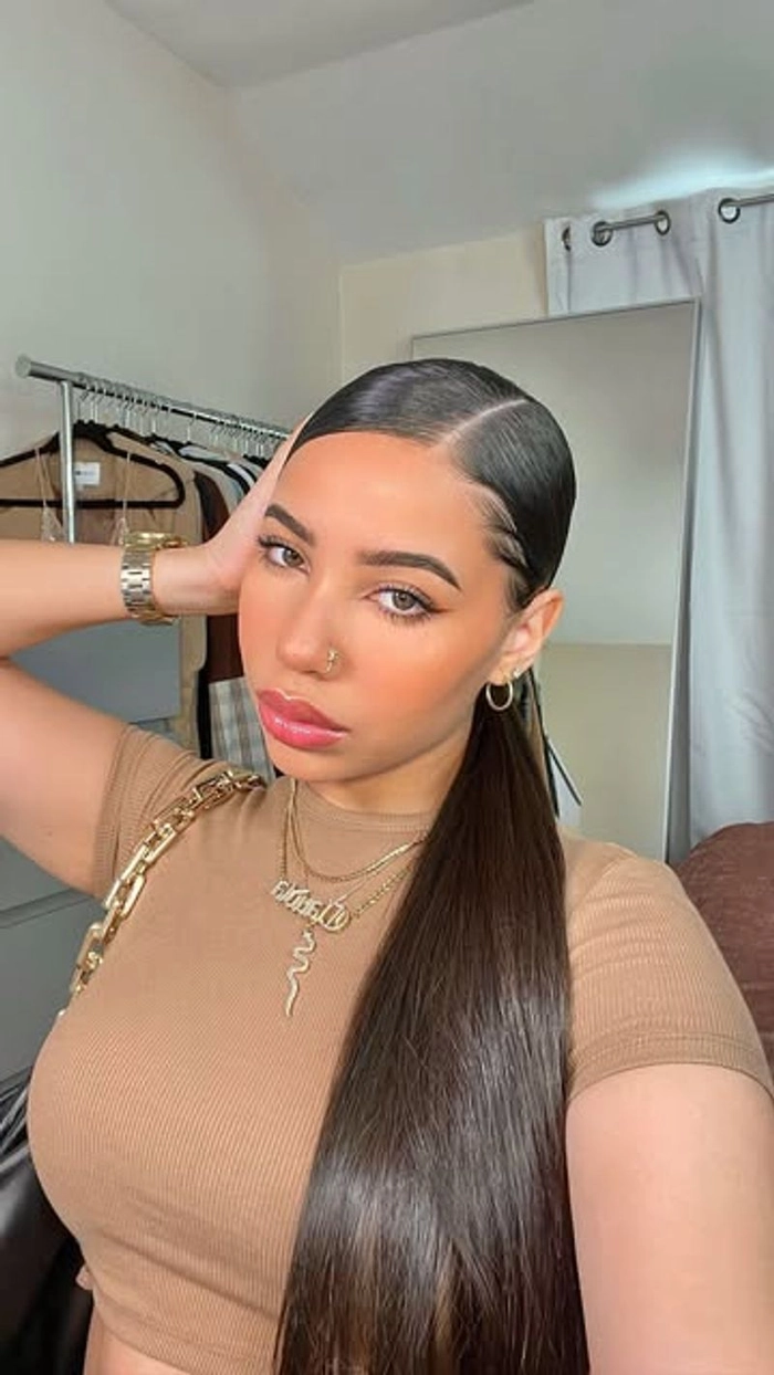 Casual hairstyle featuring a sleek low ponytail perfect for daily wear Everyday sleek low ponytail styled for minimalist casual outfits