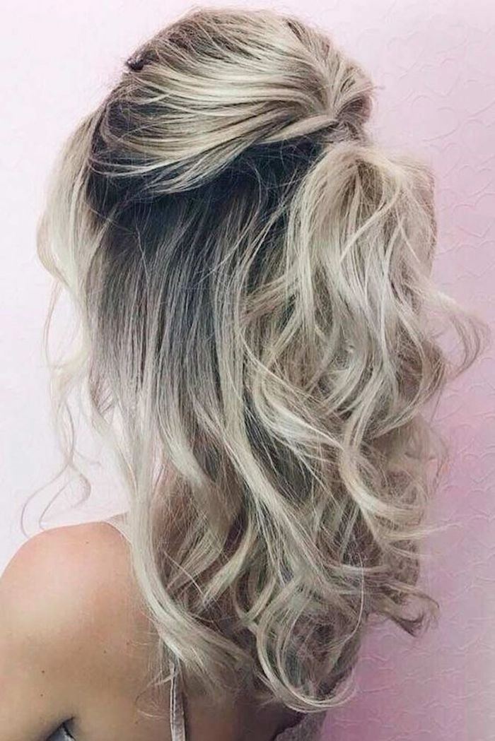Casual medium hair half up half down look perfect for everyday wear Effortless half up half down hairstyle for medium hair with soft waves in a casual setting