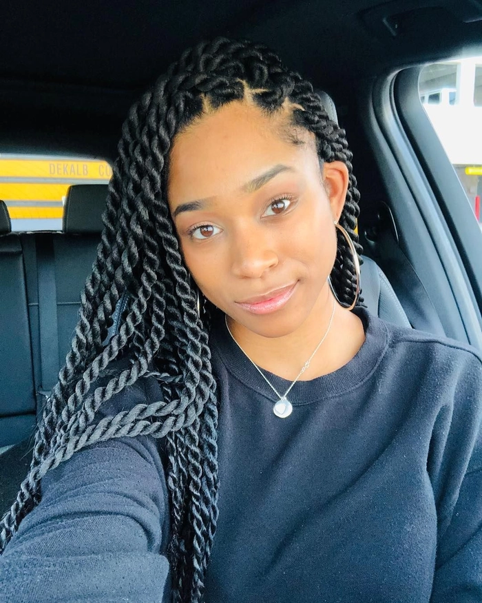 Woman with transitioning natural hair styled in a low-maintenance protective pineapple puff
