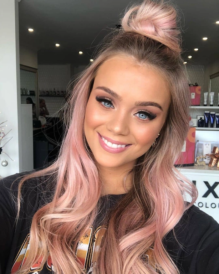 Quick high bun hairstyle for athletic casual looks Athlete in casual wear showcasing a quick high bun variation