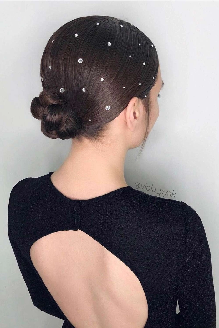 Simple pearl hair pin updos for casual holiday celebrations Woman with a casual updo accented by pearl hair pins, perfect for relaxed holiday gatherings