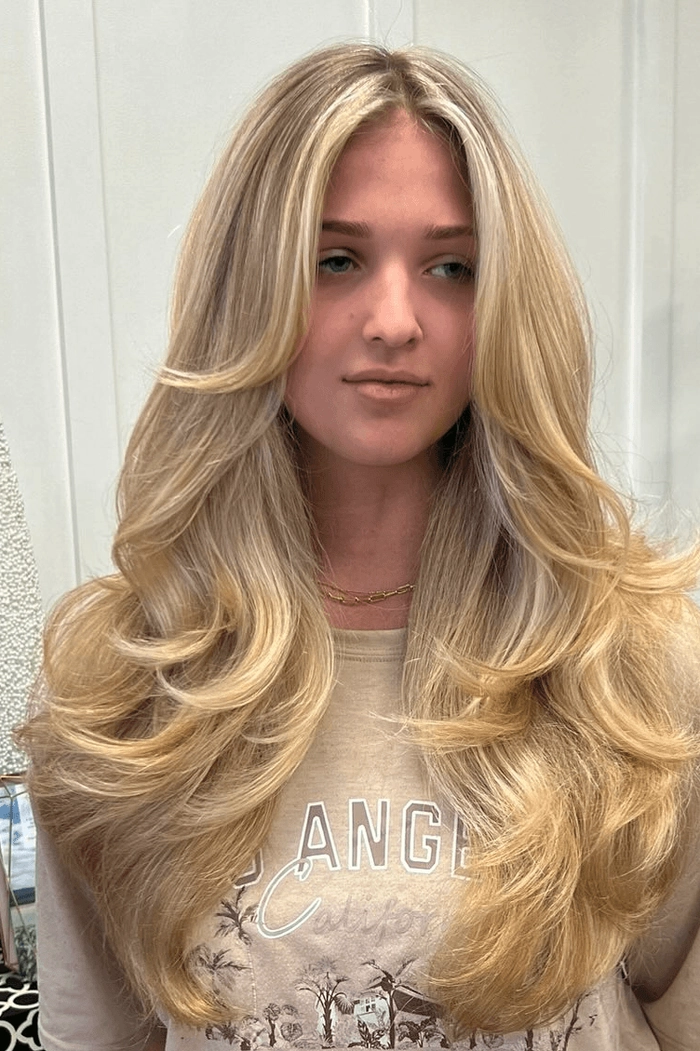 Voluminous blowout with relaxed waves for a weekend brunch outing Relaxed voluminous blowout hairstyle perfect for a long casual weekend brunch