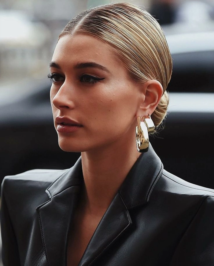 Quick slicked back low bun hairstyle for clean girl casual aesthetic, side view