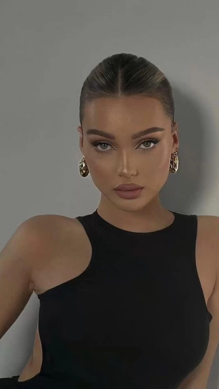 Quick sleek low bun for a clean girl casual aesthetic hairstyle
