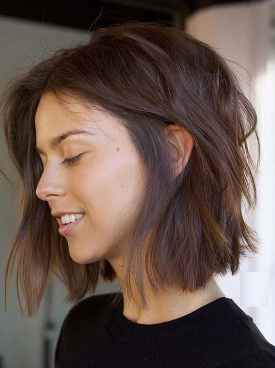 Simple tucked behind ears styling for a blunt bob haircut, casual look