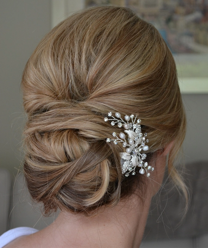 Effortless low chignon hairstyle with loose strands for casual evening dinners