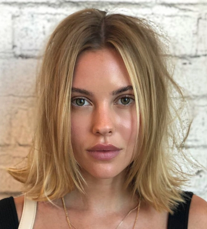 Medium retro casual hairstyle with effortless flipped ends for a relaxed look