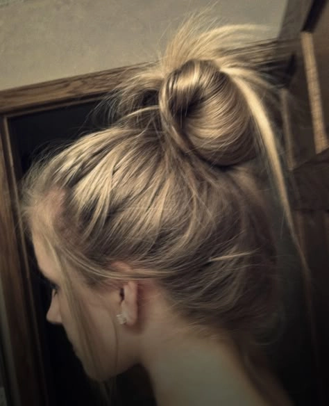 Effortless messy space buns hairstyle perfect for grunge casual aesthetics