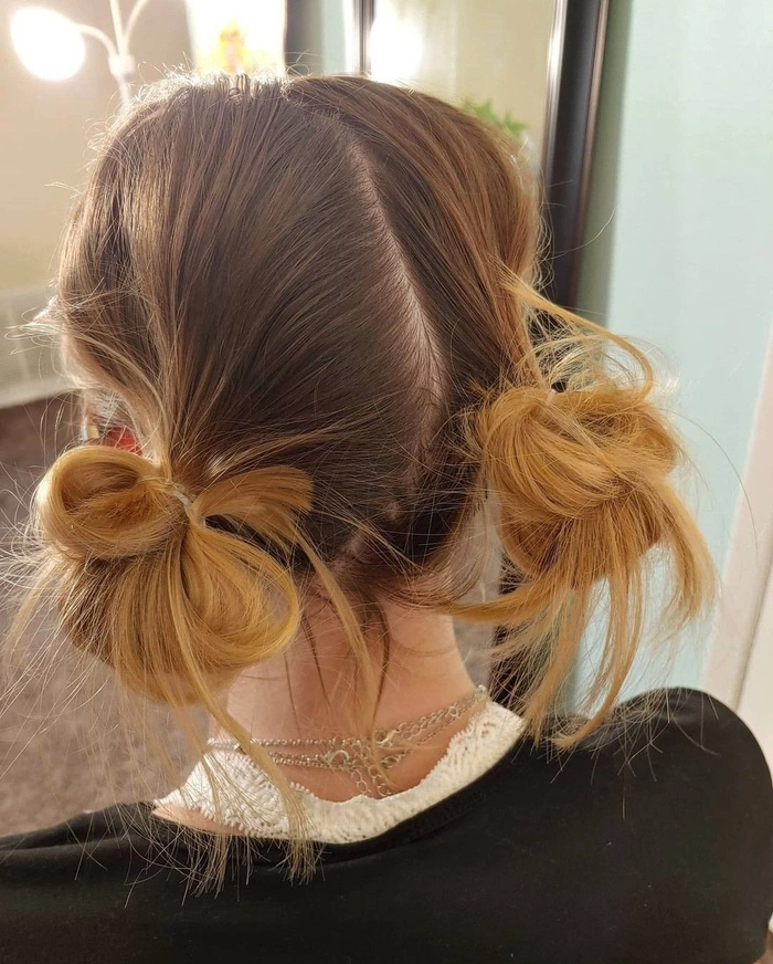 Effortless messy space buns hairstyle perfect for a grunge casual look