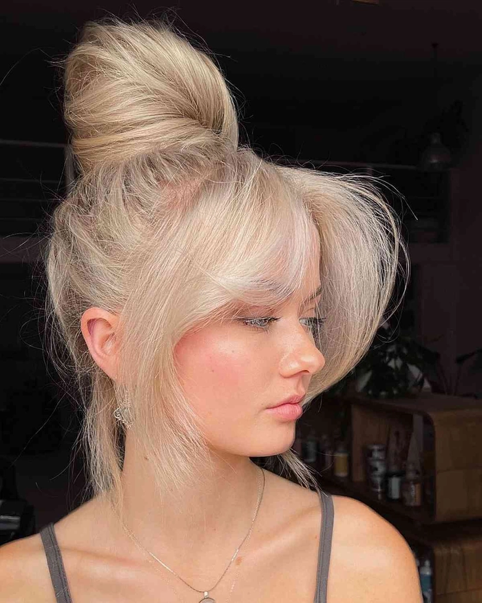 Casual second day hair styled in a relaxed messy top knot Everyday messy top knot hairstyle perfect for second day hair