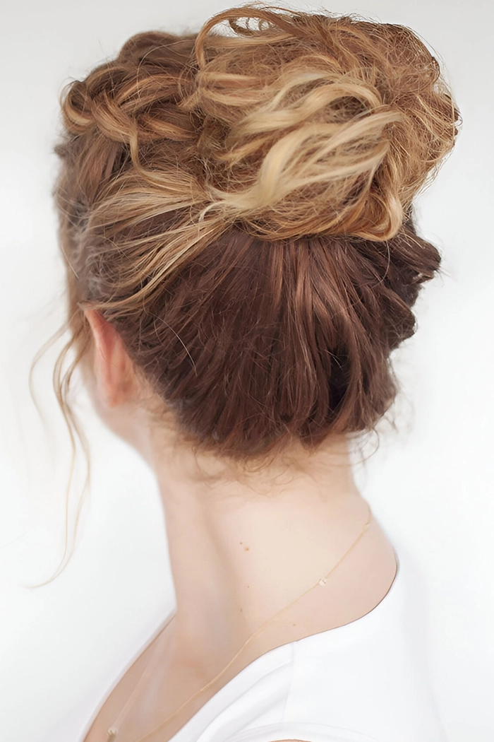 Casual hairstyles featuring an effortless messy top knot for day two hair styles Everyday messy top knot hairstyle perfect for second day hair in a casual look