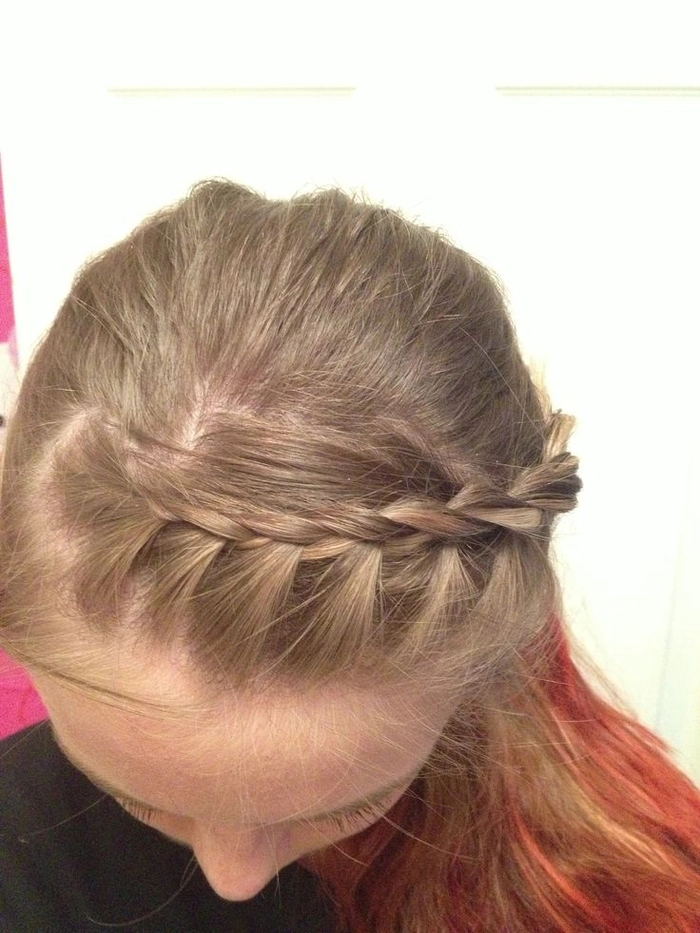 Casual hairstyle featuring quick braided bangs for an effortless face-framing style Quick braided bangs styled to keep hair out of the face in a casual look