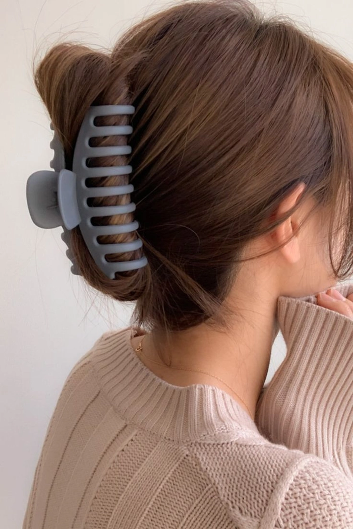 Quick claw clip hairstyle on thick, textured hair for a casual look