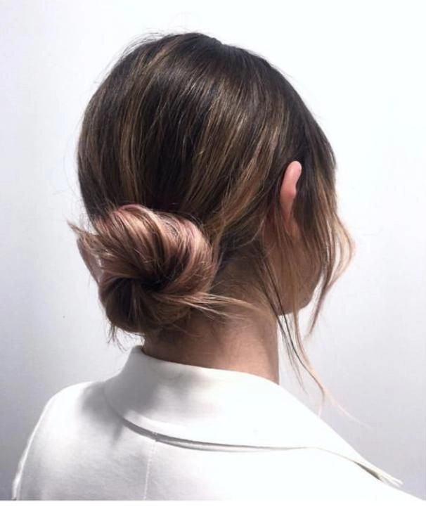 Casual hairstyle featuring an elegant low twisted bun for work and everyday wear Quick low twisted bun hairstyle perfect for professional casual settings