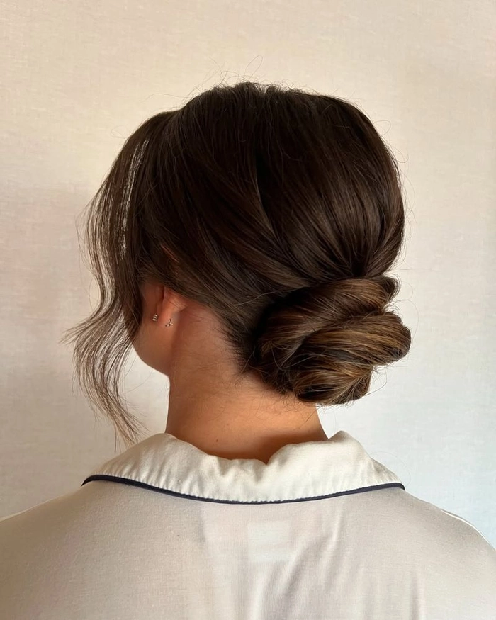 Effortless low twisted bun ideal for office and everyday casual looks Quick low twisted bun hairstyle perfect for professional casual settings