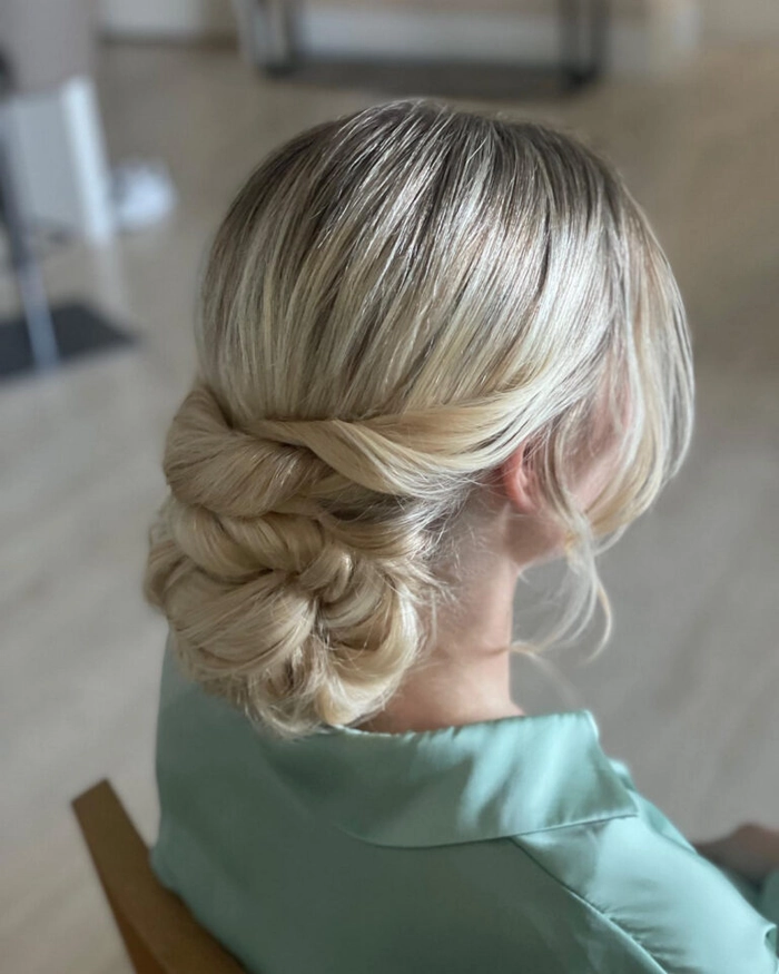 Elegant and easy-to-make low twisted bun for a polished casual look Quick low twisted bun hairstyle suitable for professional casual settings