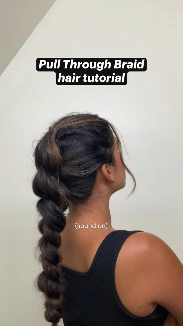 Casual hairstyle featuring a quick pull through braid on voluminous hair Quick pull through braid style on thick hair for a casual look