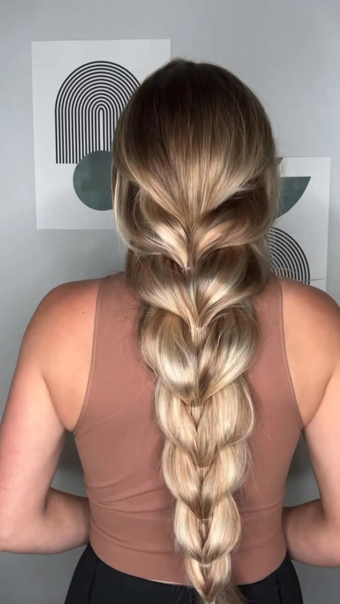 Casual hairstyle featuring a quick pull through braid for thick hair Quick pull through braid hairstyle on thick hair for a casual look