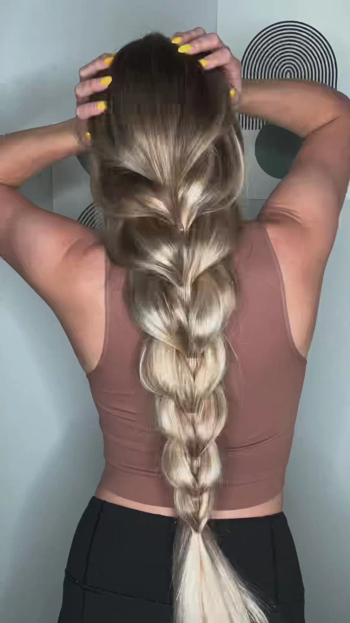 Casual hairstyle featuring a quick pull through braid on thick hair Quick pull through braid hairstyle on thick hair for a casual look