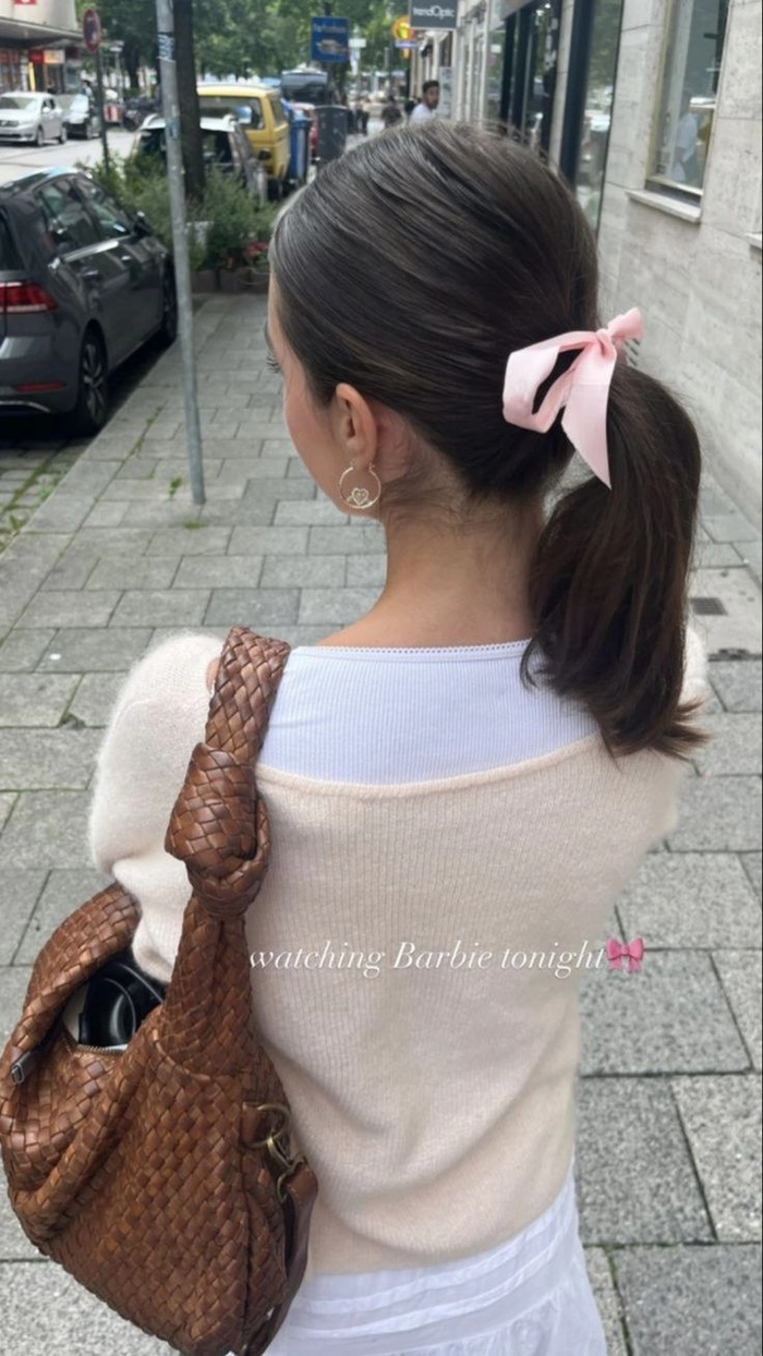 Quick ribbon ponytail styles for coquette casual fashion with a soft bow accent