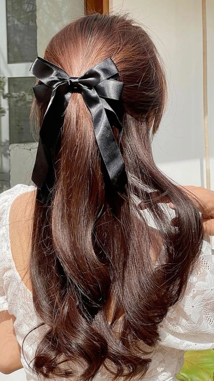Quick ribbon ponytail style for a casual coquette look