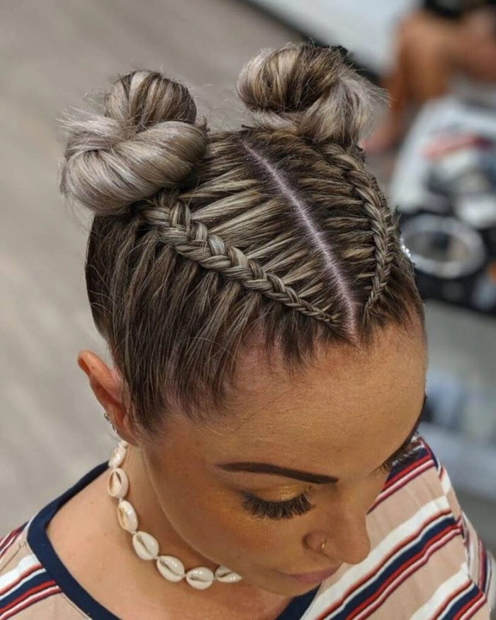 Effortless quick space buns styled for fun festival days Quick space bun hairstyle perfect for casual music festival looks