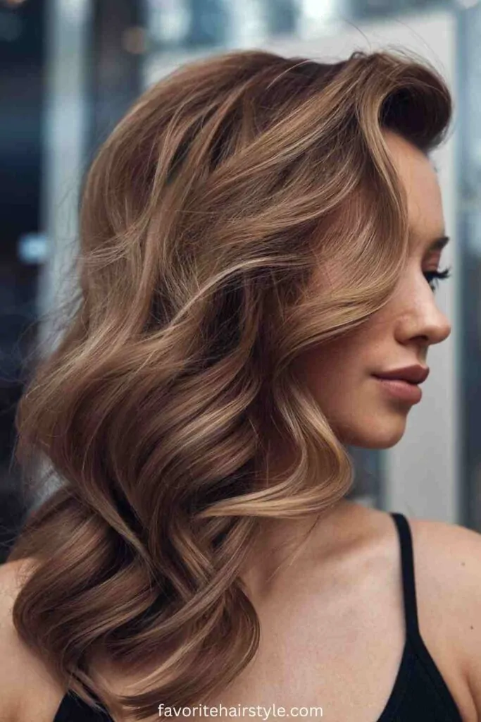 Relaxed bouncy blowout hairstyle on medium length hair perfect for a casual weekend look