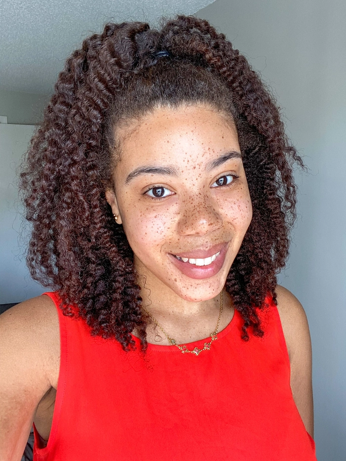 Casual look featuring relaxed braid out hairstyles for natural coils, image 9 Woman showcasing relaxed braid out hairstyles for natural coils in a casual setting