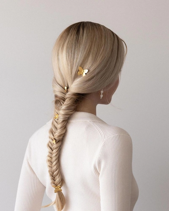 Relaxed fishtail braid on thick wavy hair showcasing a casual hairstyle