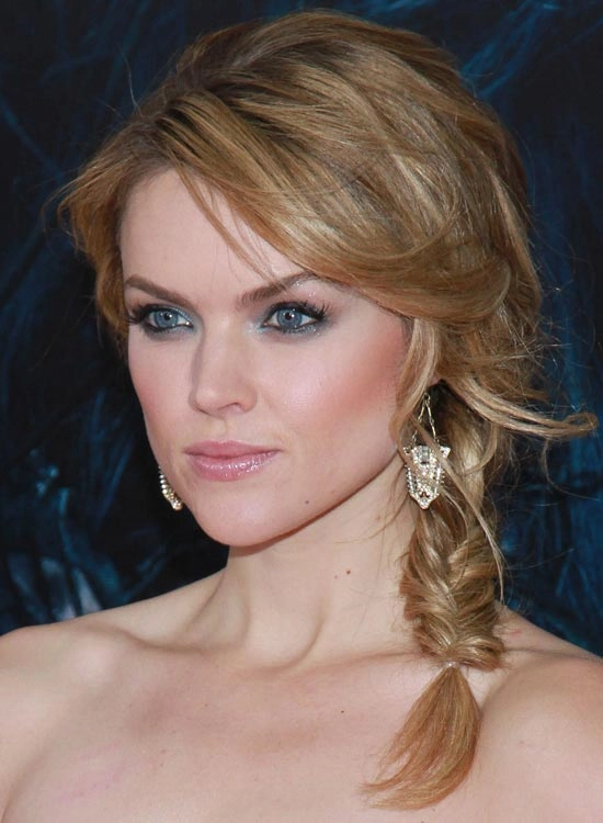 Relaxed fishtail braid hairstyle on thick wavy hair for a casual look