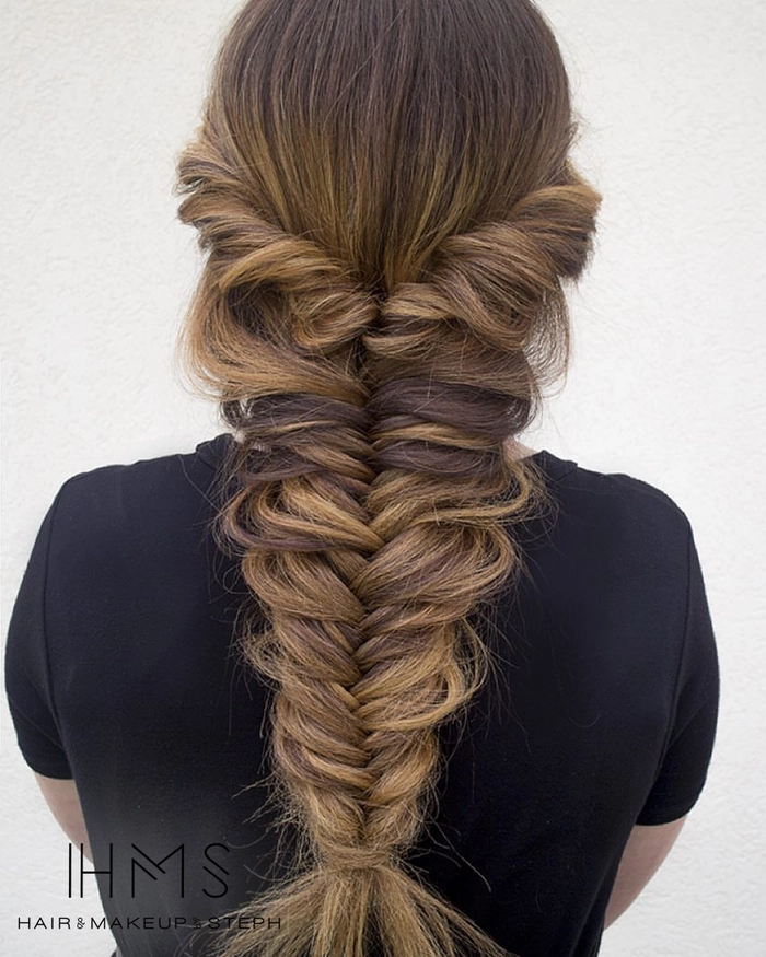 Relaxed fishtail braid on thick wavy hair showcasing a casual look