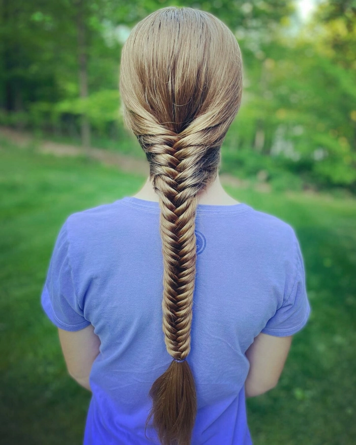 Relaxed fishtail braid on thick wavy hair for a casual day out
