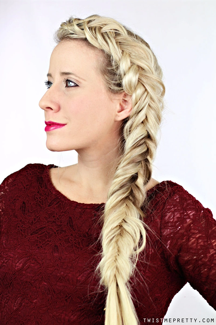 Woman with a relaxed fishtail braid showcasing thick wavy hair in a casual hairstyle