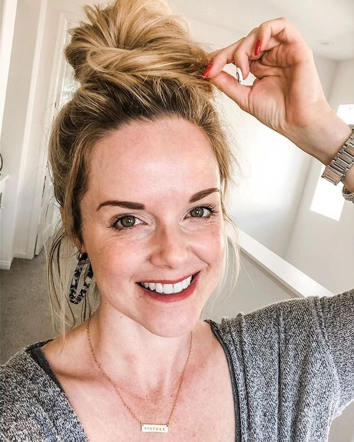 Woman with a relaxed low bun hairstyle perfect for women over 40 in casual settings