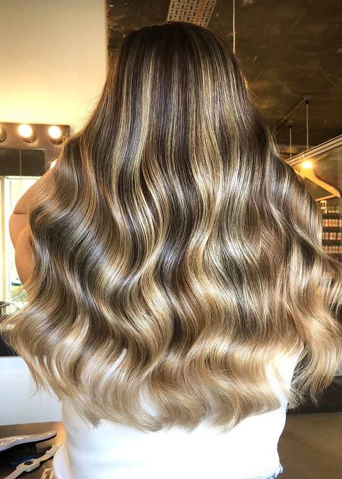 Relaxed mermaid waves hairstyle perfect for long casual beach days