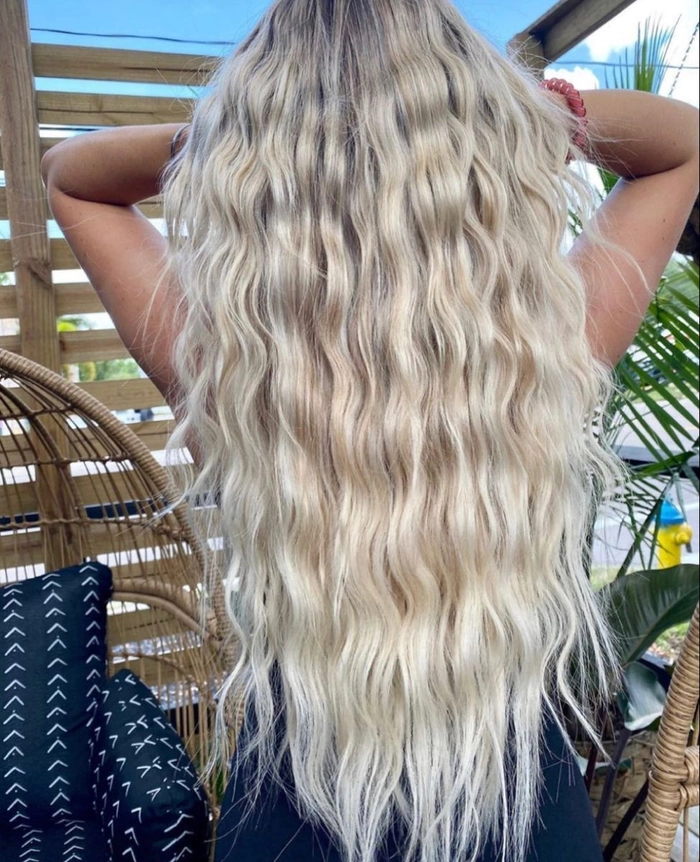 Relaxed mermaid waves cascading over long hair for a casual beach day look