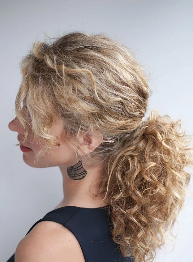 Relaxed pinned up style on medium curly hair perfect for casual settings