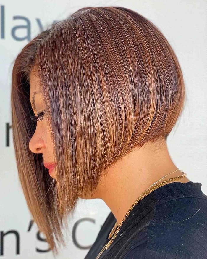 Woman with a relaxed side swept hairstyle on an asymmetrical bob