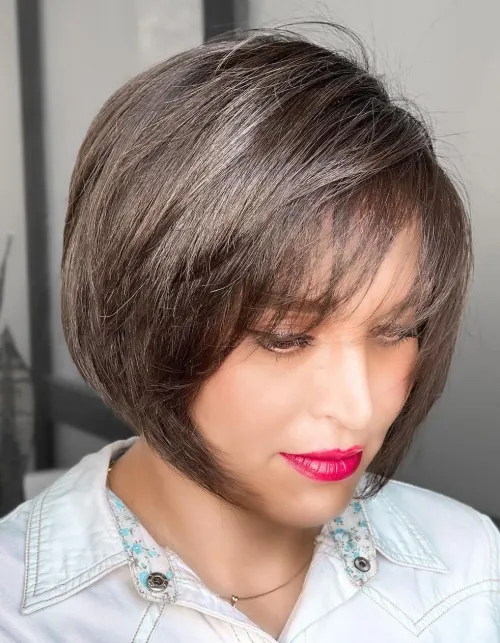 Relaxed side swept hairstyle on an asymmetrical bob for a casual look