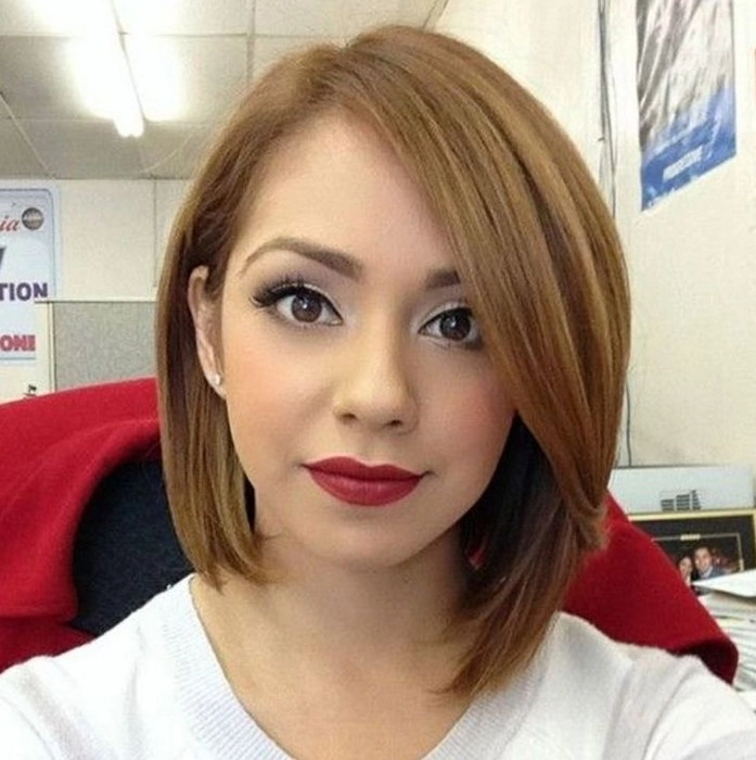 Woman with relaxed side swept hairstyle on an asymmetrical bob for a casual look